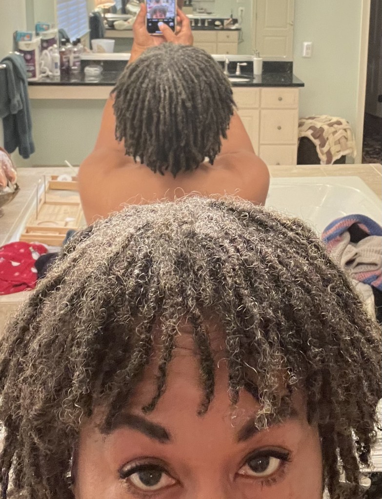 This picture shows how I installed my locs from the crown going towards my face and neck. This design protects my edges from over manipulation and gives me bangs!